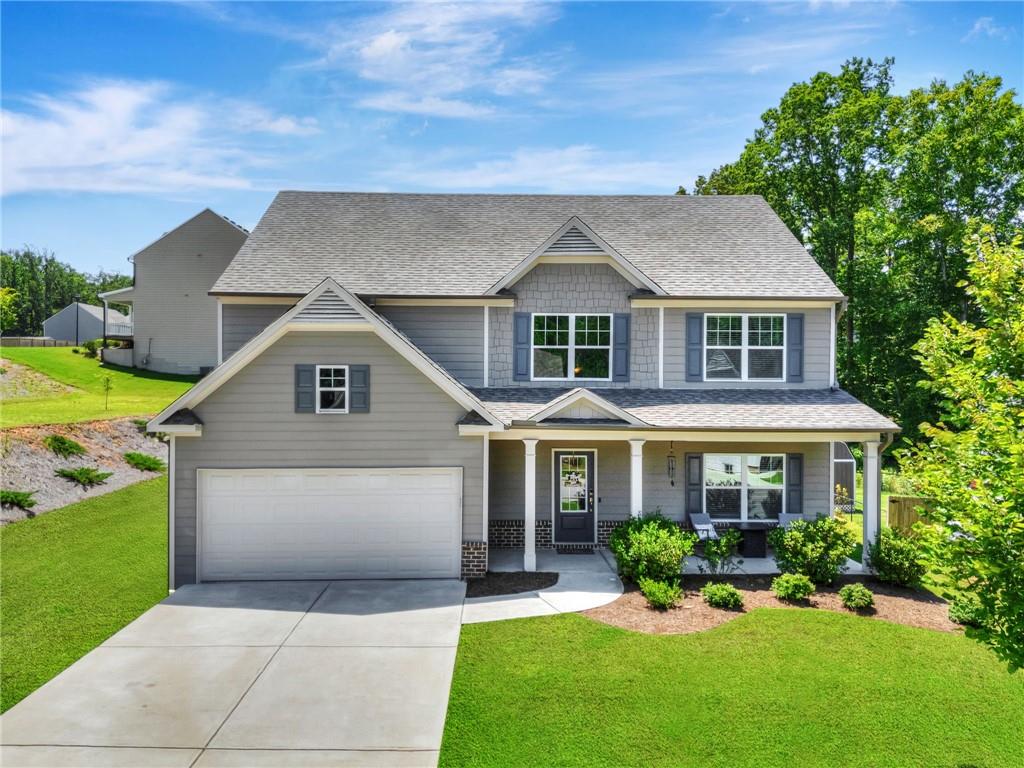 Price improvement on this beautiful home. Welcome home to this beautiful 4 BR/2.5 BA home located in a swim community. This home features a beautiful 2 story Foyer with open staircase, Powder Room, a Formal Dining Room that easily will seat 12+, a Family Room or possible Office area, huge oversized Great Room with fireplace currently being used as a game room, open kitchen concept with large island, lots of white cabinets, solid surface countertops, breakfast area, hardwood flooring on the main. On the second floor you will find 3 spacious spare bedrooms, the laundry room, oversized master suite with a large master bath with tile shower, double vanity and ceramic tile flooring. This home sits on a flat, professionally landscaped lot.
