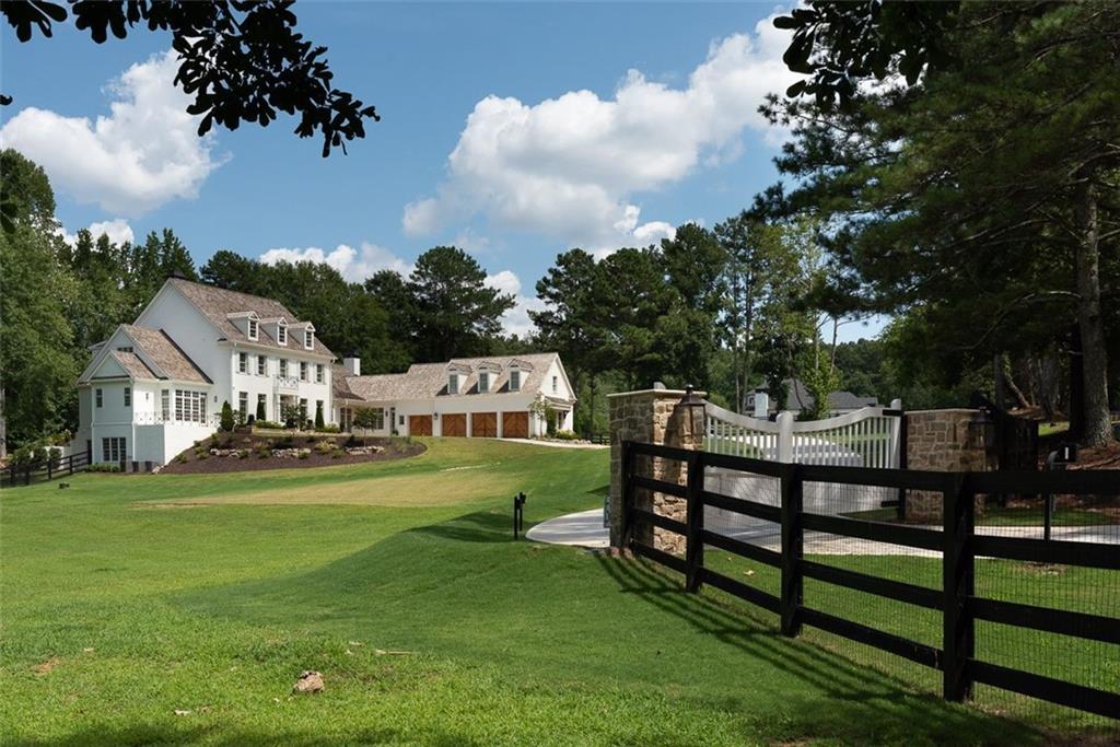 Stunning Newly built Private Estate home located on 7+ acres overlooking Providence Lake. This amazing custom built home is just minutes from Downtown Alpharetta and Avalon. An entertainer's dream with every architectural detail imaginable. Chef's kitchen w/ Sub Zero and Wolf appliances, custom cabinets with two huge islands, Open to Family Room overlooking the backyard oasis, which includes a pool and 33 acre lake. Pasture surrounds home with several storage sheds and plenty of room for a barn. Gorgeous separate Dining Room, Butlers pantry with ice maker and wine cooler. Separate den with fireplace, exquisite millwork throughout home. Master on main complete with separate steam shower and soaking tub. Master opens to private patio overlooking lake. Smart Home with the latest technology including security system with cameras covering full exterior of the home. 11 ft ceilings on main, 10 ft on second and basement, Ensuite on first floor with separate shower and soaking tub. Office on main with custom built-ins, formal and informal powder rooms. 3 large bedrooms upstairs, each with private bath. Two Laundry rooms, upstairs and on main. 4th bedroom upstairs can be used as in-law suite, has private bath, refrigerator, microwave and dishwasher.