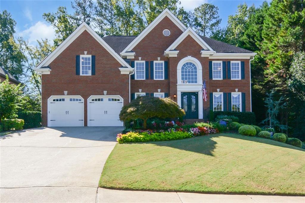 Welcome to this amazing home in the heart of the sought-after Amberfield swim/tennis community. This beautifully maintained residence offers both elegance and functionality with an open, sun-filled floor plan and thoughtful upgrades throughout—all just minutes from The Forum and Peachtree Corners Town Center. The putting green can be transformed into a completely turf yard for playtime. So many options! Step into the grand two-story foyer, flanked by a home office to the right and a formal dining room to the left. The vaulted ceilings continue into the living room, where a wall of windows fills the space with natural light and offers a beautiful view of the backyard. The living area flows seamlessly into a spacious kitchen complete with granite countertops, an island, ample cabinetry, and a charming breakfast room. Step through to the screened-in patio - an entertainer’s dream space - perfect for all-season relaxation and dining, with a grilling deck just beyond. On the main level, a full guest suite with an attached bathroom offers flexibility for multigenerational living or visitors. Upstairs, retreat to the oversized primary suite featuring a tray ceiling, sitting area, and a fully renovated spa-like en-suite with a freestanding tub, luxurious shower with four niches, corner double vanity, and a spacious walk-in closet. Three additional bedrooms upstairs include one with its own private bath and two sharing a jack-and-jill layout. The finished terrace level offers endless possibilities - complete with a full bath, kitchenette, multiple flex rooms ideal for a game room, media room, home gym, or teen retreat. There's even more room to grow with a large unfinished storage area ready to be customized. Outside, the beautifully landscaped backyard is a private retreat - and for golf lovers, a 6-hole putting green adds a fun and unexpected touch. Enjoy double sidewalks throughout the entire neighborhood, perfect for strolls, bike rides, or walking to THE YMCA or The Forum for shopping and dining! With award-winning schools and an unbeatable location, this is a home that truly offers it all.