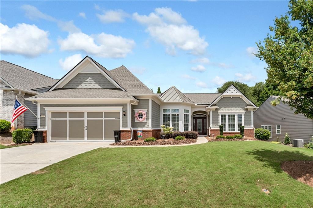 Welcome to your immaculate dream home in the highly sought-after Village at Deaton Creek, a gated 55+ community offering unmatched amenities and lifestyle. This pristine 3-bedroom, 2.5-bath home features 2,435 square feet of thoughtfully designed living space and is truly move-in ready with a long list of recent upgrades. Built in 2015 and meticulously maintained, this home shines with new roof (2023), fresh exterior paint, fresh interior paint (2025), and upgraded bathrooms. Step inside to an inviting open-concept floor plan ideal for both daily living and entertaining. The spacious kitchen with an island is a chef’s delight, featuring granite countertops, rich stained wood cabinetry, gas cooktop, built-in oven and microwave, new dishwasher, and an eat-in breakfast area. The primary suite offers a true retreat with large room to accommodate king-sized bed, newly remodeled bathroom with heated tile, new vanities, and a new zero-entry shower with double shower head, and a generous walk-in closet. There are two additional bedrooms with a must see upgraded bathroom. Extend your living space outdoors with a custom patio and pergola—perfect for relaxing or entertaining. The fenced in area provides extra privacy.
Residents of The Village at Deaton Creek enjoy the lifestyle of the resort-style amenities including the clubhouse with social spaces, indoor & outdoor pools, tennis, pickleball, bocce courts, and softball field, state-of-the-art fitness center, walking trails, dog park, and clubs and events.
All this is located just minutes from shopping, dining, healthcare, and at the foothills of the North Georgia mountains.
Don’t miss this opportunity to own a turnkey immaculate home in one of the area's premier active adult communities.