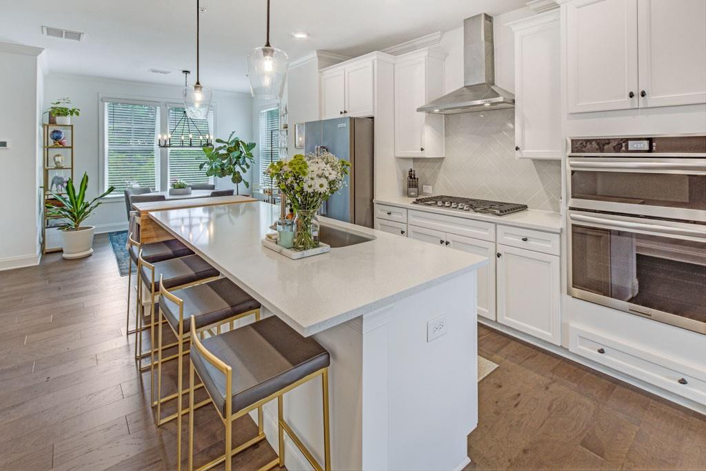 Truly a special townhome opportunity! One owner, better-than-new, END UNIT opportunity flooded with light AND builder upgrades. Lovingly and meticulously maintained! Private location within the incredible Aria community. Walkable to shops, restaurants, offices, and the fabulous Aria amenities including pool, clubhouse, meeting rooms, business center, gym, trails and more. 10 out of 10!