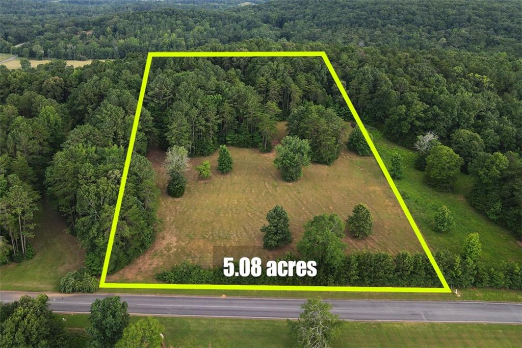 Located in Gordon County, just 15 minutes from downtown Calhoun and 12 minutes from I-75, this 5.08-acre lot in the Pine Mountain Estates Subdivision offers a blend of open space and natural beauty. The land is mostly cleared, with mountain views and a border of mature trees that provide both privacy and scenic charm. Situated in the Sonoraville and Red Bud School Districts, this lot is also close to shopping, schools, and outdoor recreation. Whether you’re looking to build now or invest for the future, this property offers great potential. Water and power are available at the road. Level 3 soil analysis available. Boundaries are marked by white metal rods.
