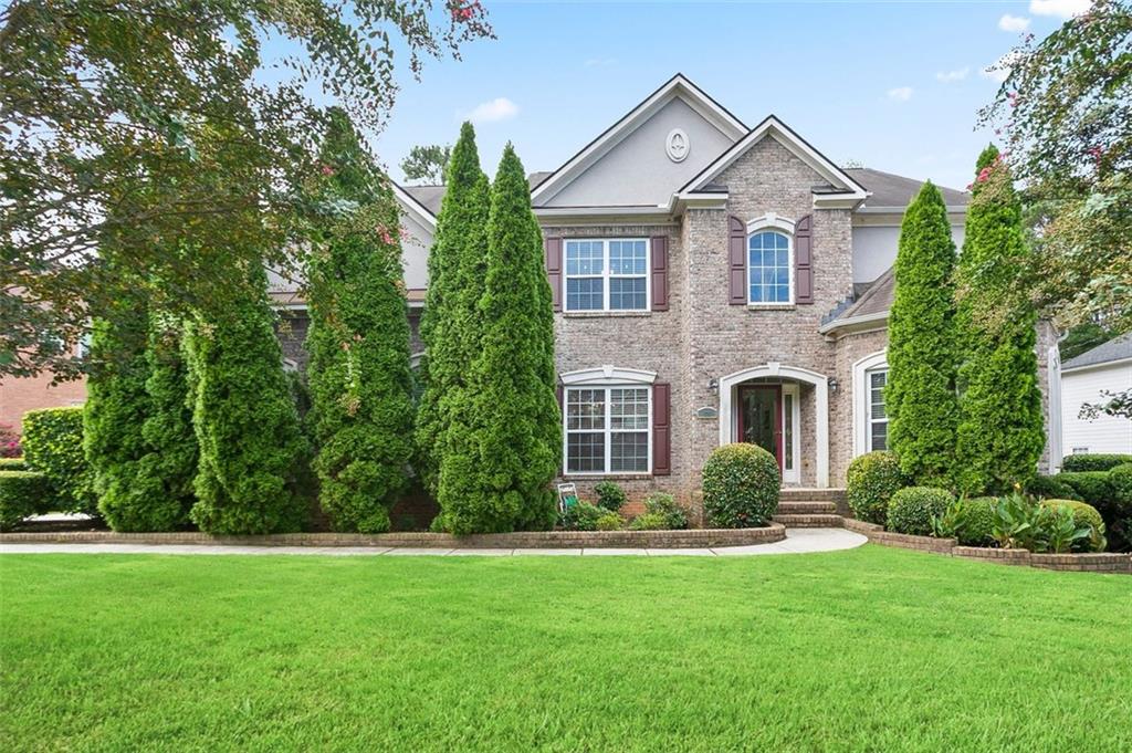 Located in the prestigious swim, tennis, and golf community of The Links, this beautifully maintained 5-bedroom residence offers three complete levels of living space, including a fully finished basement.
The exterior features a classic brick front elevation with exceptionally kept landscaping, setting the tone for the quality throughout. Inside, you’ll find a two-story living room filled with natural light and a spacious kitchen complete with granite countertops, double ovens, and abundant cabinetry. The main level also includes a bedroom with a full bath, ideal for guests or multi-generational living. Upstairs, you’ll find four generously sized bedrooms, including an expansive owner’s suite with dual closets and a large private bath.
The finished basement provides an additional full level of living, featuring a second full-size kitchen with appliances, breakfast bar, family room, and two versatile rooms perfect for office space, fitness, or hobbies.
Outdoor living is maximized with a screened-in patio on the second level and a covered patio at the basement level, both overlooking a spacious backyard with stunning views of hole #15 of the golf course.
This home offers the perfect combination of luxury, function, and community amenities, making it an ideal choice for family living in one of the area’s most sought-after neighborhoods.