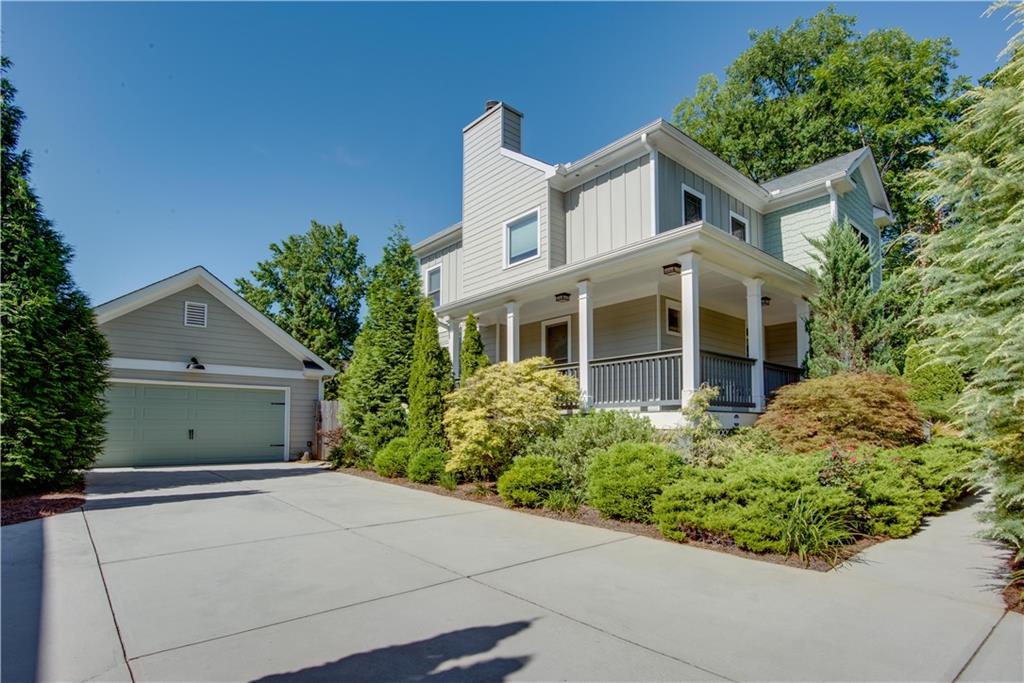 Welcome to this beautifully maintained home in the sought-after Egan Park community! Enjoy relaxing on the wraparound front porch or in your private backyard oasis, complete with a low-maintenance yard that blooms with surprises all year long. Backyard is completely fenced. Inside, you'll find a spacious open floor plan with gleaming hardwood floors throughout. The family room features a lovely coffered ceiling and a cozy fireplace (with gas starter), which flows seamlessly into the large chef’s kitchen. Kitchen includes stainless steel appliances, quartz countertops, a walk-in pantry, and abundant storage. A separate dining area provides the perfect space for entertaining. The main level also offers a bedroom with a private en-suite bath. Upstairs you'll find an incredible primary suite with a tray ceiling, walk-in closet and a spa-like en-suite bathroom with double sinks. Upstairs also includes two generously sized secondary bedrooms, with a shared bath. A detached two-car garage completes the home. Seller is retiring and has loved living here, but is moving out of state. Conveniently located near Hartsfield-Jackson Airport, Delta HQ, Porsche, major Atlanta highways, Tyler Perry Studios, and Woodward Academy’s main campus.