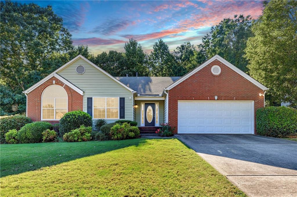 First time on the market! Spacious 4BR/2BA ranch with all living on one level plus a full daylight, walk-out basement. Features include tall ceilings, vaulted dining room, beautifully trimmed, with hardwood floors, vaulted front bedroom with Palladian window, and a vaulted sunroom overlooking the private back deck. The oversized master suite offers double vanity, walk-in closet, and updated tiled accessible shower. Home is fully accessible with garage ramp in place. Original finishes throughout give buyers an opportunity to update and add value. Basement provides excellent storage or finish for additional living space. Large .88-acre lot in a quiet neighborhood close to schools, shopping, and dining—convenient to I-985 and I-85.