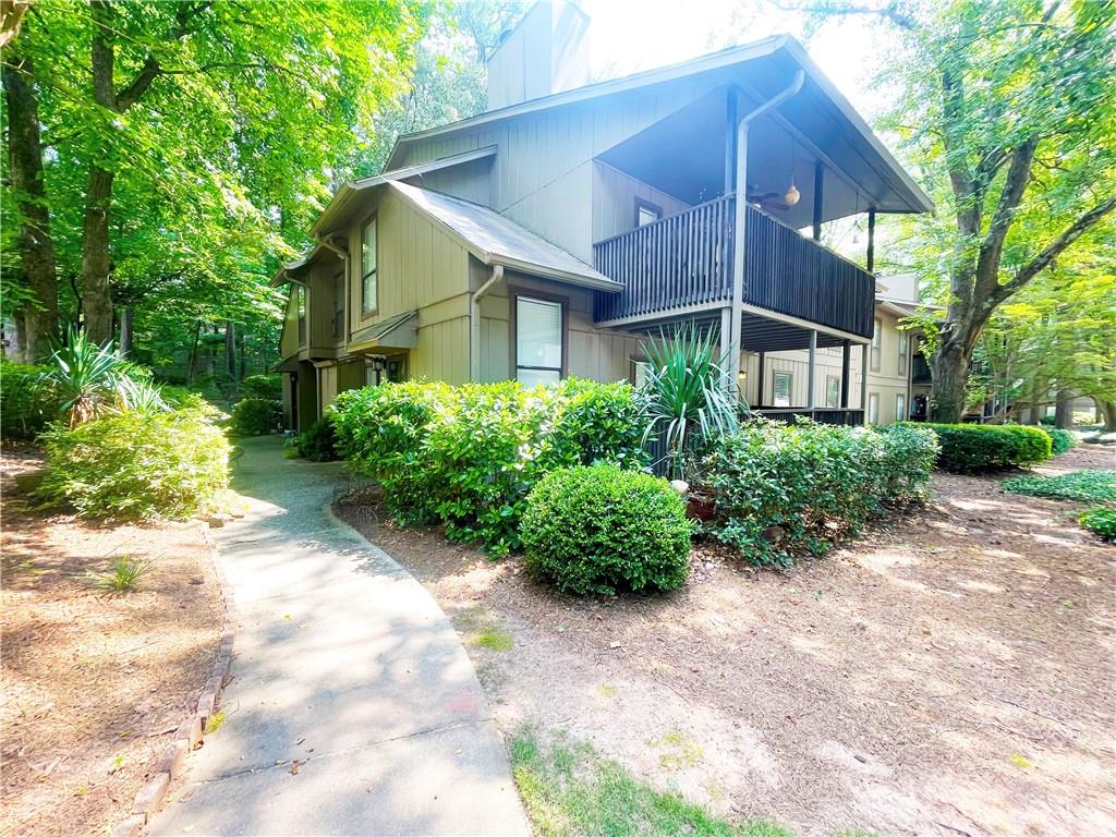 Welcome to this charming 2-bedroom, 1-bathroom condo ideally located in the heart of Smyrna. Step inside to an inviting family room featuring a cozy fireplace, perfect for relaxing evenings. The kitchen offers white cabinets, granite countertops, stainless steel appliances including a gas range, and a convenient breakfast bar. The primary bedroom features a spacious walk-in closet and direct access to the shared bath. Enjoy your morning coffee or unwind in the evenings on the covered patio overlooking the community grounds.
This sought-after community offers fantastic amenities, including two swimming pools, lighted tennis courts, and two dog parks, providing endless recreation options. Located just minutes from Cumberland Mall, Truist Park, The Battery, and with easy access to I-75 and I-285, this condo is perfectly positioned for shopping, dining, and commuting. Don’t miss out on the opportunity to own this low-maintenance home in an unbeatable location!