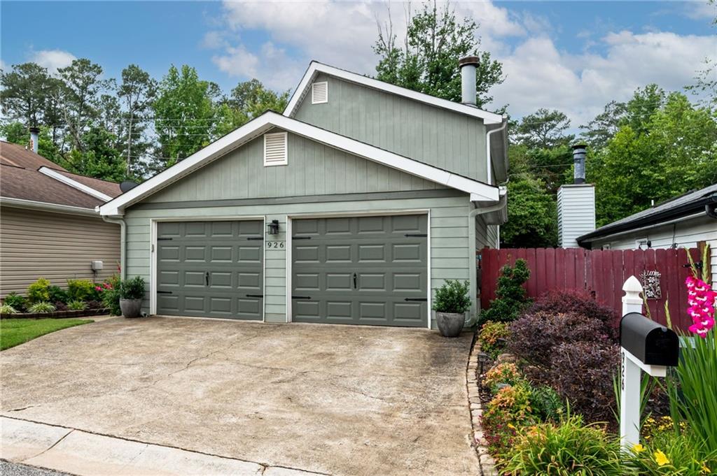 This beautiful two-bedroom home is in the highly sought-after community, The Village ~ Marietta. This home features LVP flooring throughout, a newer HVAC, a newer water heater and a 2-car garage. The foyer will greet your guests with open arms. The chef’s kitchen features granite tile and butcher block countertops, tile backsplash, plenty of cabinet space and bar seating. The family room features a stone fireplace and is ready to entertain your family and friends. The open floor plan continues with a dining room and a powder bathroom. The master suite boasts a vaulted ceiling, a walk-in closet, a skylight in the bathroom that adds natural light, tile floors, a tiled walk-in shower and an updated vanity. The second suite also features a vaulted ceiling and a walk-in closet. The full bathroom features a skylight, a claw tub and has recently been renovated. The loft is perfect as an office, den, playroom or media room. The back deck is ready for all your summer BBQ’s. There is plenty of room to run and play in the private fenced-in backyard. The community amenities include a pool and clubhouse. The monthly HOA dues cover termite, trash and common area maintenance. The home is walking distance to nearby grocery stores, less than 5 miles to Truist Park, Cochran Shoals Park (great for kayaking, biking, hiking, and shooting the hooche), conveniently located near I-75 and I-285, parks, restaurants and shopping.
