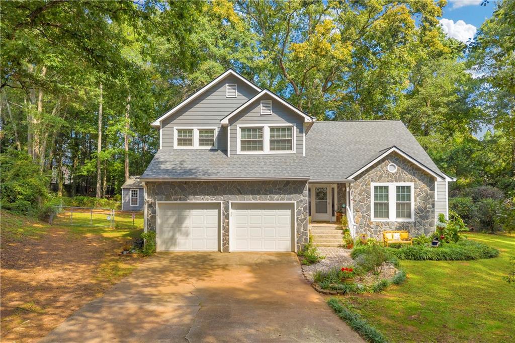 Do you like quiet, NO HOA, cul-de-sac living? Do you dream of having chickens, and a space for animals on your property? If so, 101 Elberta St is for you! This 3 bedroom, 2.5 bathroom home sits on a sprawling, private, 1 acre lot perfect for outdoor living. The yard features a large shed, a chicken pen, and plenty of room for gardening, animals, or simply enjoying the open space. Inside you'll find a main-floor Primary Suite for easy living, along with a bright Sun Room where you can relax and enjoy the outdoor scenery, a dedicated Office, and even a Wet Bar with a mini drink fridge. The main level also includes laundry and a spacious garage. Upstairs you’ll find two additional bedrooms, a full bathroom, BRAND NEW FLOORING on the stairs and second level, plus a large walk-in attic for storage. With a BRAND NEW ROOF (less than a month old), FRESH PAINT, and unique spaces for work, play, and entertaining, this home offers both comfort and character. Schedule your showing today!