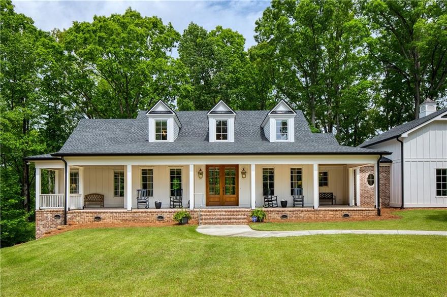 Nestled in the heart of Milton, Georgia, just three miles from the vibrant downtown Alpharetta, this stunning custom farmhouse is a true masterpiece. Situated on a private, expansive two-acre lot, this builder’s own home blends timeless craftsmanship with modern luxury.
Boasting five spacious bedrooms and five and a half beautifully appointed bathrooms, this residence is designed for comfort and sophistication. The main level features a serene master retreat, while an additional master suite above the garage offers privacy and versatility. Throughout the home, heart of pine floors exude warmth and character.
Entertain effortlessly in the chef’s kitchen, complete with top-of-the-line Wolf and Sub-Zero appliances, perfect for culinary enthusiasts. The finished basement adds even more space for recreation, relaxation, or hosting guests.
Step outside to the breathtaking covered porch, where a striking craftsman-style stone fireplace sets the stage for cozy evenings. Whether you're sipping morning coffee or enjoying an alfresco dinner, this inviting outdoor space is a dream. The charming rocking chair front porch, adorned with an elegant brick herringbone pattern, offers a warm and welcoming entrance, perfect for peaceful afternoons spent enjoying the scenery.
Luxury, privacy, and timeless charm—this Milton farmhouse is more than a home; it’s an experience. Don't miss the chance to make it yours!
