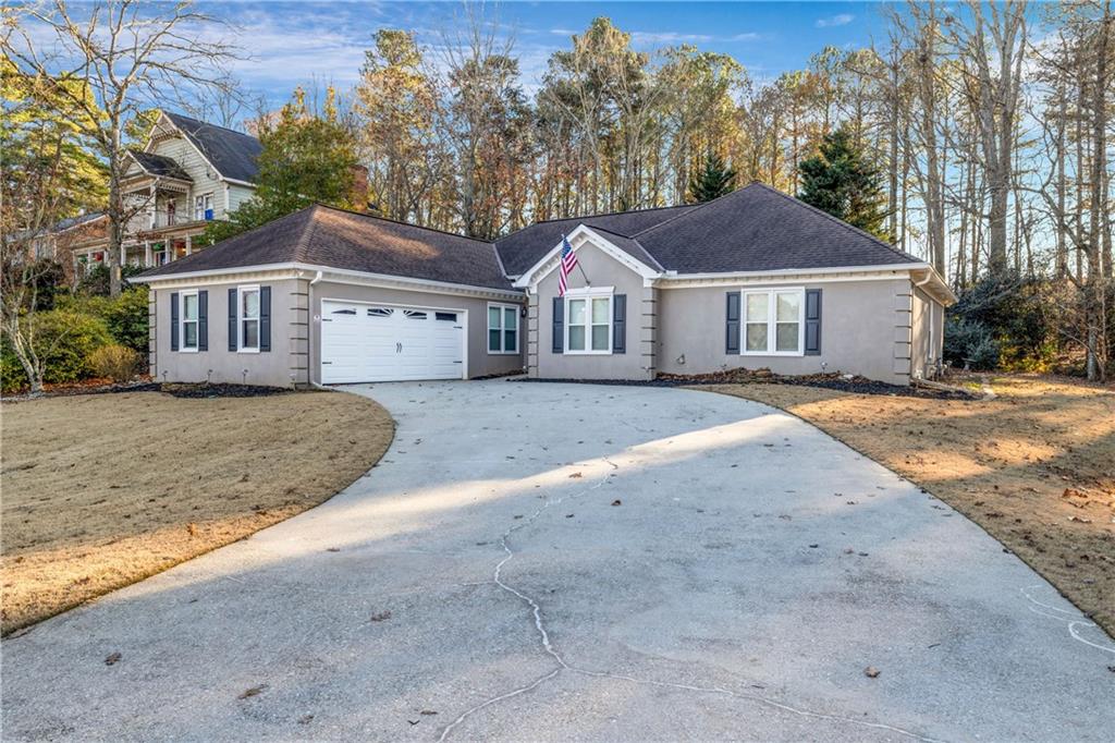 RENOVATED RANCH in Buford!! Seckinger School District! It Features 3 bedrooms and 2.5 bathrooms. It has been remodeled, upgraded & updated! Granite counters & tile flooring in kit & all baths. Large Kitchen with Breakfast Bar, island, eat-in area, pantry, 5 burner gas range & tons of counter space. Large Master suite with accent walls Design, Master bath with soaking tub & frameless shower door. Family Room with Fireplace, NEW paint in & out, windows & roof (2015), plantation blinds, high efficiency Trane HVAC. Don't Miss This Opportunity.