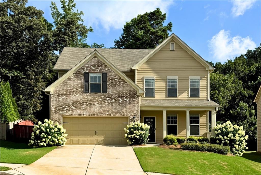 Welcome to this better-than-new home in the newer phase of Settlers Lake—built by Taylor Morrison and lovingly maintained by its original owner since 2019. Thoughtfully upgraded and move-in ready, this home offers all the benefits of new construction without the wait or the stress. From the moment you arrive, the blooming hydrangeas and mature landscaping create standout curb appeal. Step inside to find a spacious, light-filled layout with hardwood floors on the main level and a kitchen designed for everyday living and entertaining—complete with granite countertops, a walk-in pantry, and a large island that brings everyone together. A nearby office or flex room offers a quiet space to work or unwind. Upstairs, you’ll find generously sized secondary bedrooms with plenty of closet space, a large laundry room, and a serene primary suite with walk-in closet, soaking tub, and separate shower. One of the secondary bedrooms includes a private ensuite bath—perfect for guests or additional privacy. The fenced backyard is an ideal setting for quiet mornings or relaxed evenings outdoors. Located in top-rated North Forsyth schools and just minutes from GA-400, Settlers Lake also offers resort-style amenities within walking distance: a pool, playground, tennis and basketball courts, and a neighborhood lake with a swim dock. This home feels brand new—or even better—with thoughtful upgrades already in place and nothing left to do but move in and enjoy. With standout details inside and out, this home is ready to impress—come see it for yourself!