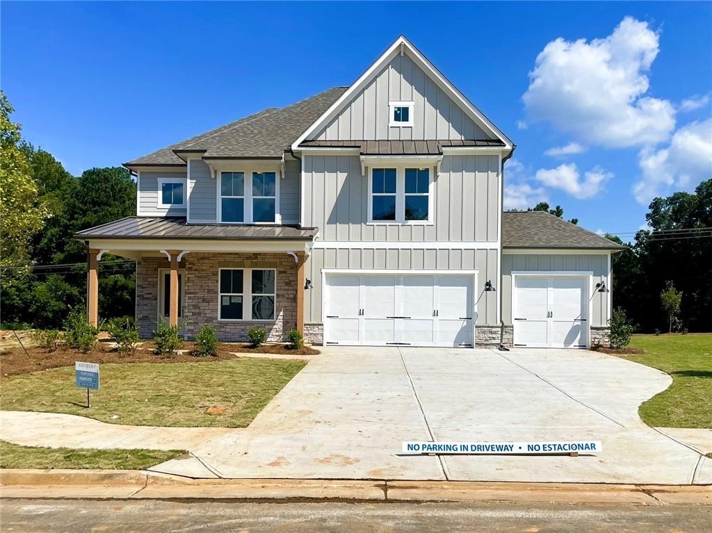 Bold, Beautiful, and Move-In Ready | Up to $15K in Buyer Incentives. Discover refined living in this stunning Wesleyan “A” plan—a 5-bedroom, 4-bath home thoughtfully designed with over 3,100 sq ft of upscale comfort in Ashbury Commons, a boutique West Cobb community. Step inside and be welcomed by warm Cinnamon Walnut flooring, rich Charcoal cabinetry, and a dramatic stacked mosaic backsplash that sets the tone for the gourmet kitchen. Featuring Viatera White Pearl quartz countertops, matte black accents, and stainless Frigidaire Gallery appliances, this kitchen is made for entertaining. A private guest suite on the main floor offers flexibility, while the upstairs primary retreat stuns with a freestanding tub, bold black fixtures, and soothing Paradise Grey tilework. Every bathroom is a showcase of designer-selected quartz, tile, and hardware—creating spa-like moments throughout. LIMITED-TIME INCENTIVE: Enjoy up to $15,000 in Flex Cash to use your way—toward closing costs, interest rate buy-down, design upgrades, or a price reduction (must close by 12/18/25 with preferred lender). Conveniently located near top-rated schools, parks, and shopping in vibrant West Cobb. Schedule your tour today—this home is ready when you are.