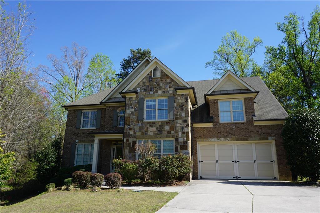 Tucked in a prestigious enclave, this home offers refined living just steps from Mall of Georgia, shopping centers, popular eateries, and entertainment venues. Minutes to I-85 and I985 freeway access makes daily commuting effortless, while the community’s serene surroundings offer a true escape.
Enjoy a range of amenities including tennis courts, a swimming pool, basketball court, soccer field, and a clubhouse—making it an ideal and fun environment for a family. The home features an elegant exterior accented with stacked stone and brick. Inside, the gourmet kitchen showcases beautiful moldings, solid stone countertops, an oversized island, and a built-in wine rack. The family room boasts a coffered ceiling and a cozy fireplace, while the den or formal living room includes built-in shelving and a fireplace framed by French double doors. A guest suite on the main level provides a perfect space for in-laws or visitors. Upstairs, the expansive master suite offers double vanities, large walk-in closet, separate jaccuzi tub and shower. 4 additional bedrooms upstairs. The two Jack-and-Jill bathrooms provide convenience and comfort for the additional bedrooms. Enjoy the perfect blend of quiet, upscale living with urban accessibility. New paint, new flooring throughout the entire house, new refrigerator and some of the kitchen cabinet doors will be replaced with new ones. Min. 12 month lease terms, prefer 24 months lease term. Min FICO of 700 and 3 x of rent are required to apply.