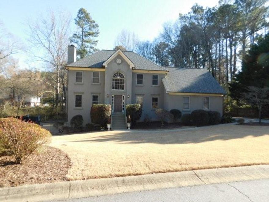 Gorgeous home in East Cobb with hardwoods on main and upper levels. There is a 2-story foyer with separate dining room, large living room with fireplace, ceiling fan and French door access to the rear deck. Granite counter-tops in kitchen with stainless steel appliances (gas stove, refrigerator, dishwasher, microwave), disposal, and breakfast area. There is a half bath and laundry room with washer/dryer hook-ups. Upper level features two spare bedrooms and full hall bath with tub/shower combination. The master bedroom is spacious with walk-in closet. Master bath has a jetted tub, dual vanities and separate shower with enclosure. Basement includes 2 additional carpeted bonus/bedrooms, another large bonus with kitchenette with sink, cabinets & dishwasher with French door access to the rear of the home, and a full bath with tub/shower combination. Home has a 2-car side entry garage with auto-opener. Additional photos will be added soon. Great Cobb schools!!  No aggressive dog breeds.   Ask about move-in special.