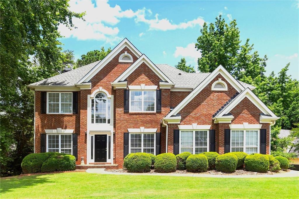 Beautiful Home in Highly Sought-After Ruby Forest. Ideally positioned on a professionally landscaped corner lot, this charming home offers a spacious, level front yard and a fully fenced backyard. Enjoy direct access to scenic trails leading to the Suwanee Greenway and top-rated North Gwinnett schools. The open-concept kitchen boasts granite countertops, a large breakfast area with backyard views, and flows seamlessly into the inviting family room with a cozy fireplace. A separate dining room and formal living room provide the perfect spaces for entertaining. A guest bedroom and full bathroom are conveniently located on the main level. Upstairs, the expansive master suite features a walk-in closet, double vanities, a soaking tub, and a separate shower. Three additional generously sized bedrooms complete the upper level. The finished basement includes an additional bedroom with a half bathroom—ideal for guests—along with designated areas for entertainment and storage. Located in a vibrant, active community offering swim and tennis amenities, a playground, miles of sidewalks, and easy access to George Pierce Park and Suwanee Town Center.