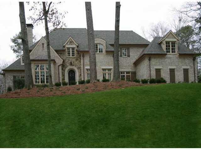 Stunning Craftsmanship and incredible private lot. 12' Ceilings, his & her master baths, beautiful solarium overlooks private backyard. Top of the line custom theater. Work out are with sauna, steam, and spa. In-Law Suite on Lower Level. Beautiful Pool with Waterfall off main level terrace.