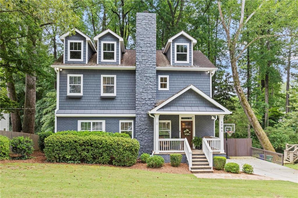 Situated in the highly sought-after Ashford Park neighborhood, this fully renovated home blends modern elegance with thoughtful design. A charming flagstone front porch welcomes you into a grand two-story foyer, setting the tone for the open and inviting main level. Perfect for entertaining, the spacious floorplan features a seamless flow and a built-in surround sound system that extends to the outdoor deck and private back yard. Wood burning fireplace in the living room makes for cozy family time. The bedrooms on the main level also make a great office.
Upstairs, all bedrooms boast vaulted ceilings for an airy, expansive feel, along with a generous laundry room for added convenience. The luxurious primary suite includes a spa-inspired bathroom with a double vanity and dual shower heads—designed for both style and comfort. Very functional storage in the exterior entry full height crawl space. Don’t miss this rare opportunity to own a turnkey home in one of Brookhaven’s most desirable communities!
