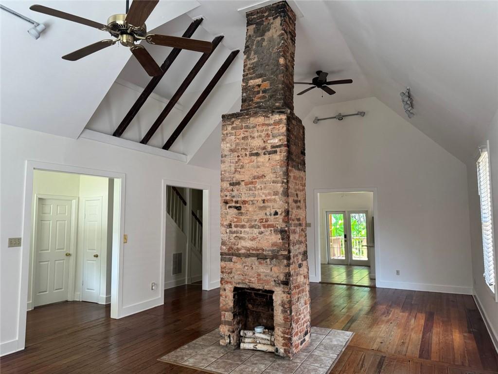 Discover the perfect blend of historic charm and modern lifestyle in this enchanting Cabbagetown home. Built in 1920, this historically registered home is thoughtfully updated, 199 Pearl Street SE offers 2 bedrooms, 2 full baths, and a flexible loft space ideal for working, creating, or relaxing.
Inside, original heart-pine hardwood floors shine under natural light, complementing the open layout and stainless steel kitchen finishes. Enjoy daily comforts with in-unit laundry and central air. Updated closets with plenty of storage space are found throughout.
The fenced backyard, graced with banana trees, is a tranquil retreat, while off-street parking—rare for this neighborhood—provides added convenience. This property is ideally suited for those seeking character-rich living just steps from the BeltLine's greenway, shopping, and dining.
This rare rental opportunity combines historic charm, walkability, and space — perfect for professionals, creatives, or anyone who values living in one of Atlanta’s most iconic neighborhoods.