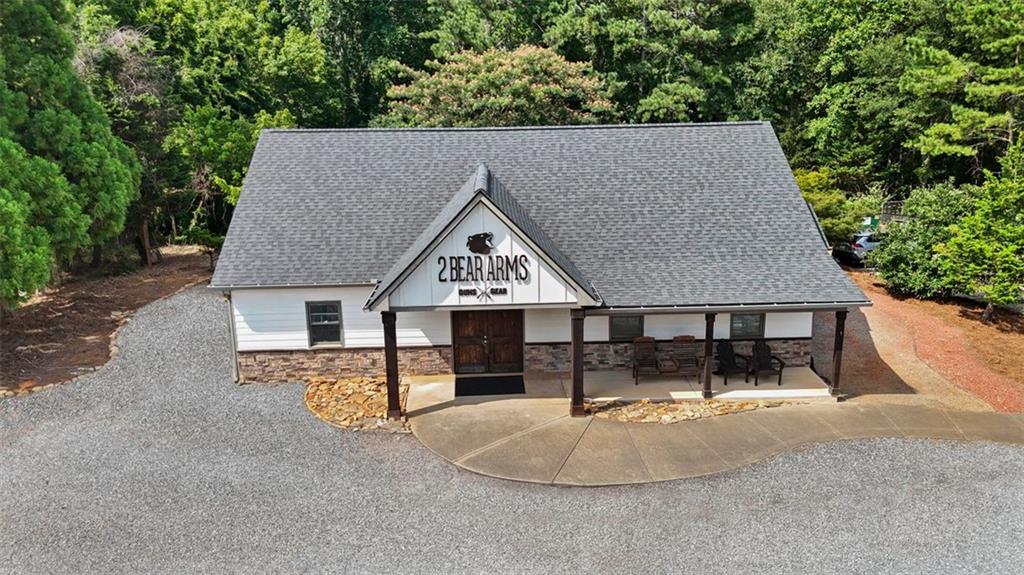 Rare Commercial Opportunity on Prime Corner Lot in Cherokee County, one of North Metro Atlanta’s fastest growing communities! Versatile commercial property strategically positioned on Hwy 140, a high-traffic area passing through the heart of Canton with ~20k+ VPD. This property offers unmatched visibility and accessibility, ideal for a variety of business uses or potential commercial development. The building features a spacious open floor plan, a dedicated office area, storage space, and a private restroom. Perfectly suited for a functional and adaptable space. Recent updates include a brand-new roof and the addition of 600 sq ft of finished space, enhancing both utility and value. Adjoined by an additional 0.94 acres zoned general commercial (GC), offering 1.96 commercial acres and boasting approximately 388 ft of road frontage.
Easily accessible, ample on-site parking, and is surrounded by established and emerging residential neighborhoods and thriving commercial development. Conveniently located just minutes from I-575, Riverstone Pkwy, Hwy 140, Downtown Canton, The Mill, Etowah River, outdoor parks and so much more. Hwy 140 & Pearidge offer direct access to major corridors and the rapidly expanding market, only minutes from Teasley Middle School PLUS the highly anticipated, upcoming New Cherokee High School expected to open August 2026.
