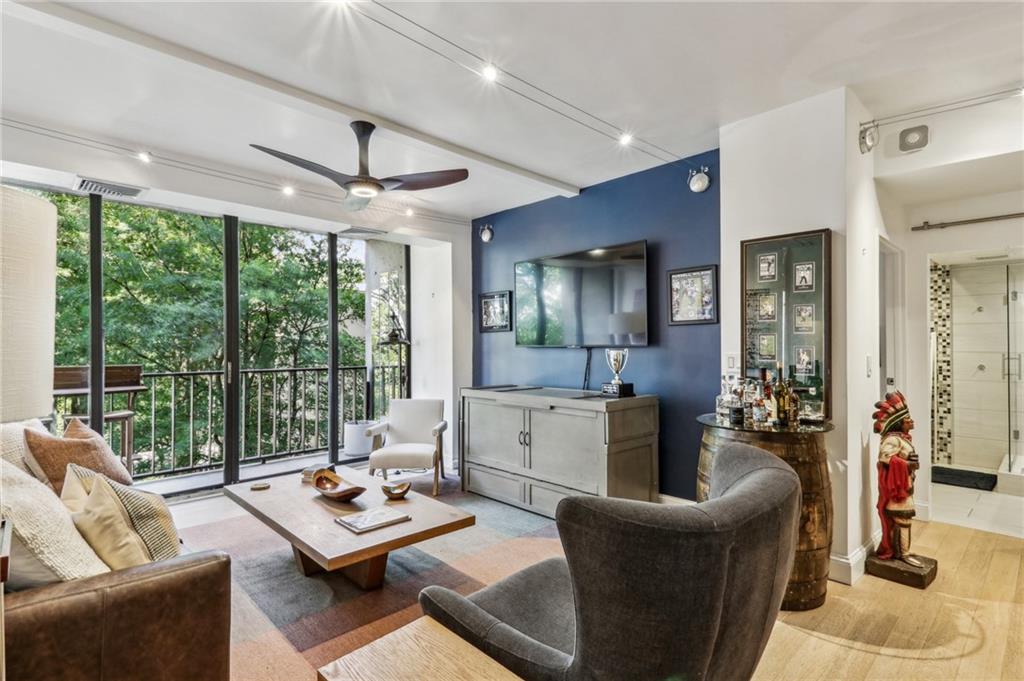 Beautiful renovated unit in re-imagined Colony Square. Chef's kitchen with huge pantry, stainless counter tops and PEDINI cabinets, GAGGENAU fridge/beverage cooler & dishwasher, SUB ZERO freezer drawers, BOSCH washer/dryer, Miele oven, and TEPPANYAKI induction cooktop. French oak flooring & automated window shades; GROHE bath fixtures, and heated towel bar add to the elevated bathroom experience. Terrific storage throughout the unit. The living area features floor-to-ceiling wall of windows connected to a northwest facing balcony. Great location that is ½ block to Arts Center MARTA station. Short stroll to Piedmont Park and the Botanical Gardens. Located in the highly desirable Midtown - Colony Square complex with every sort of entertainment at your doorstep. IPIC Theater, Politan Row, Rumi’s Kitchen, Holman & Finch, Saints & Council among others. Publix and Trader Joes and Whole Foods are all nearby. HOA fee includes Heat, Air, Electricity, Water, Basic cable & Internet. Super fitness center at Colony Square $25 per month for residents.