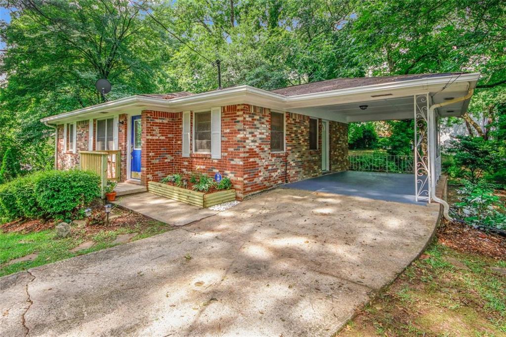Welcome to East Atlanta! Renovated four-sided brick gem looking for new buyers to create heart felt memories. Plenty of upgrades in this cozy well-loved home on a full partially finished basement. This home is situated on a large .4 acre lot with new rear sod for all your back yard entertainment. Equipped with 4 bedrooms, 2.5 baths, new paint, updated crown molding, new hardwoods, new open kitchen with new cabinetry, new country island, tile flooring, granite counters, glass tile backsplash, new under cabinet lighting, new LED lighting, new fixtures throughout, new SS appliances, tankless water heater. All bathrooms have been updated with new tile flooring, new vanities, & new plumbing. 1 car carport with additional parking in driveway. Golden opportunity to become a neighbor in a great close knit community conveniently located to Atlanta Zoo, parks & green space, & downtown ATL.