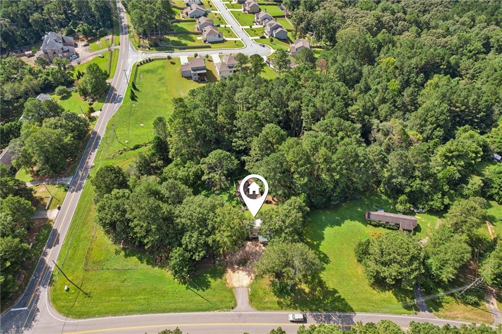 DON'T MISS THIS OPPORTUNITY! Versatile 2.7± acre corner lot zoned for potential mobile home use and possible commercial development—ideal for a convenience store or similar venture. This prime location offers endless possibilities for investors and developers. Property is being sold as-is. Do not disturb tenants. Contact us today to explore the potential!