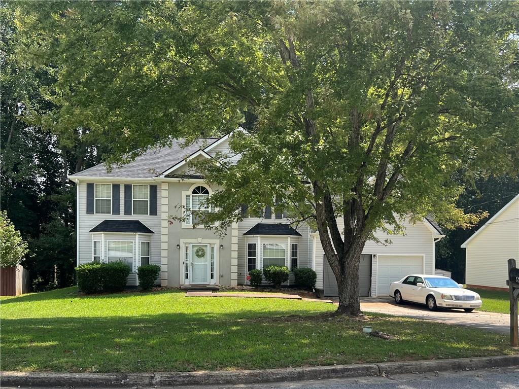 Welcome to this spacious 5-bedroom, 3-bath traditional home perfectly situated in a quiet cul-de-sac within an established neighborhood. Designed with both function and comfort in mind, this home offers a flowing floor plan featuring a sunken family room, a formal living room, and a formal dining room—ideal for entertaining or everyday living. The main floor boasts a generously sized bedroom and full bath, while the dual staircases provide convenient access to the upstairs living quarters. The front staircase leads to the owner’s suite with private bath and two additional bedrooms, while the rear staircase offers a private entrance to a large bedroom—perfect for guests, teens, or a bonus space. Enjoy a two-car garage, ample storage, and timeless curb appeal. With plenty of room to grow, this home is ready for your personal touch.
