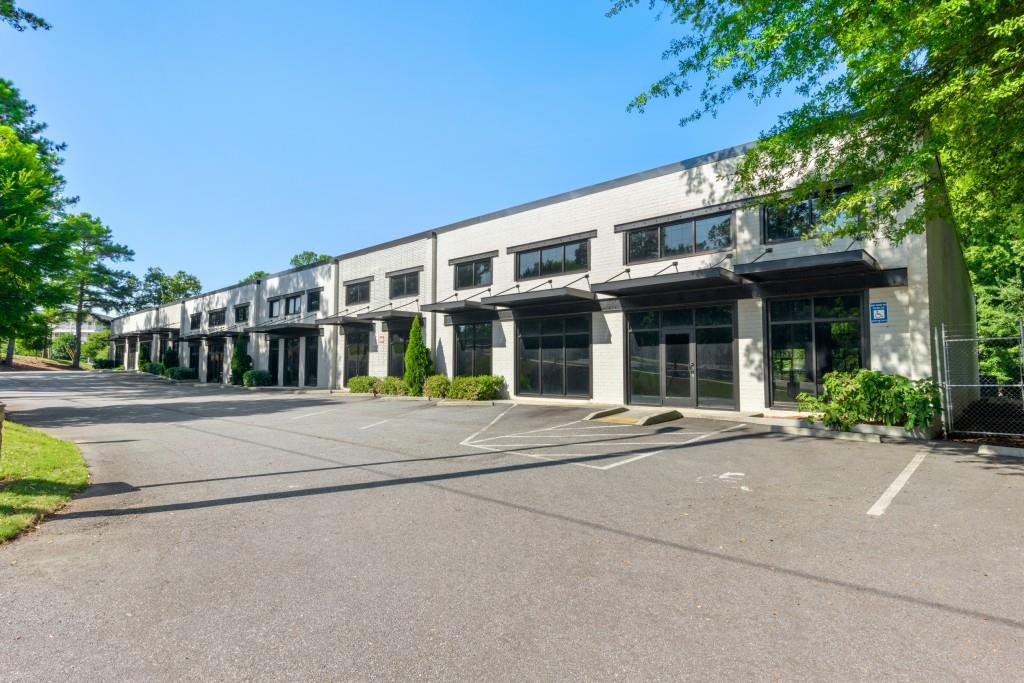 This amazing Industrial/Flex building, located in a prime area of Atlanta, offers exceptional flexibility and over $1 million in recent capital improvements. Currently divided into four suites, the property can easily be reconfigured into a larger open space or subdivided into up to eight separate units. Notable upgrades include a new TPO membrane roof with metal decking, 12 new Trane HVAC units, and fresh exterior paint. With over 80 parking spaces, including ADA-compliant parking, and access from both the front and rear of the property, this building is well-equipped to accommodate a variety of business needs.  The location is unbeatable, with close proximity to Peachtree Industrial Blvd, I-285, and just two blocks from Chamblee Village. It's also conveniently located two miles from Peachtree-DeKalb Airport and only one mile from the Chamblee MARTA station, ensuring easy access for employees and clients. Whether you're looking for a new headquarters, expanding your operations, or investing in a highly versatile property, this space offers a unique opportunity in one of Atlanta's most strategic commercial areas.