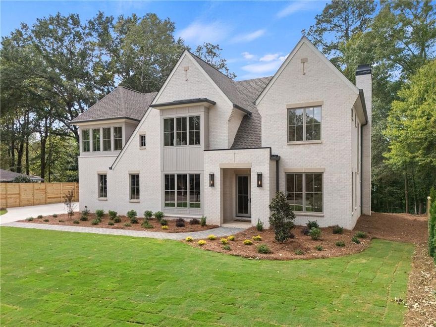 Love where you live in this COMPLETED NEW CONSTRUCTION residence in Historic Roswell! You’ll easily learn why Roswell was voted one of the best places to live in Georgia in 2024. Offering a suburban feel with a true thriving downtown acting as the heart of the community. There is no shortage of activity from your doorstep when you live here. Golf cart to Canton St to eat at award winning restaurants, stroll the River boardwalk along the banks of the Chattahoochee, join the street party of Alive in Roswell, or enjoy summer evening concerts at Roswell’s Riverside Sounds. In Roswell, you can easily get carried away because there is something impressive for everyone at every stage of life. At 125 Spring Dr, it all begins on a tree lined street filled with mature residences. Tucked away is a curated transitional residence with a timeless design for modern living. Serenity awaits in this well thought out floorplan. Here’s a quick summary of the highlights: 5200 sq ft across TWO LEVELS with an ELEVATOR SHAFT, Owner’s suite up, KT, FAM ROOM & Eating Area open onthe rear of the home, Guest Suite on Main, Laundry Rooms UP & DOWN, Separate BONUS ROOM plumbed for WET BAR, COVERED REAR PORCH with fireplace, DOG WASH & BIG BACK YARD! 
            Now let’s talk through the details! An inviting foyer gives you a moment to take it all in; you’re immediately greeted with a straight line of sight to the 8’ tall, 16’ wide sliding doors that lead to the covered outdoor porch with a fireplace and stairs that descend to a FLAT BACKYARD with room for a POOL (subject to Roswell permitting)! Back inside, adjacent to the foyer is an open flex space that easily serves as a comfortable lounge or study. Opposite this space sits a paneled dining room bathed in natural daylight with a pass-through butler’s pantry equipped with a wet bar with Kohler fixtures and a Zephyr Preserve beverage cooler. Pass through to the HEART of the home where a grand Kitchen, eating area, and family room await. The meticulously designed kitchen features natural wood tone contemporary cabinets, a 9’ island, SS Thermador appliances, commercial grade refrigerator and elegant quartzite countertops. Keep this space guest ready and keep the mess in the connected SCULLERY with 2nd Thermador dishwasher, microwave drawer, space for an additional refrigerator and wall to wall pantry shelving. Entertain in the seamlessly connected family room with wood burning fireplace and under stair wine storage with the option of climate control. Two sets of sliding doors, 12’ in the eating area and 16’ in the family room, keep you connected to a blank palette for outdoor living with a rear porch, open grilling deck with outdoor gas line connection, and private, generous rear yard that can accommodate your future plans for a firepit, pool, play space for kids and yard for the dog. Rounding out the main floor is a guest bedroom with ensuite bathroom and a rear entry hall with mudroom, laundry room with pet wash and a home office. The staircase to the upper level is a tunnel of natural light with a 10’ tall window! Here you’ll find an impressive owner’s suite with 15’ vaulted ceiling, view to a private back yard and a resort style bathroom. No detail is spared with dual vanities, a soaking tub, shower stall with designer fixtures and two closets- one equipped with a storage system and the other as a dressing room. Also on this level are three additional bedrooms all with private baths. A surprise bonus room with wrap around neighborhood views, a private bath and a potential wet bar space give you the man cave you needed! Other modern comforts include an ELEVATOR SHAFT, 3 car garage wired for EV charger, tankless hot water heater and energy efficient spray foam attic insulation. HOME is COMPLETE! Perfectly situated near the Roswell Mill with Canton St to the North, Chattahoochee River boardwalk to the south, East Cobb to the west and 400 to the east. Location, Luxury and Lifestyle all converge here!