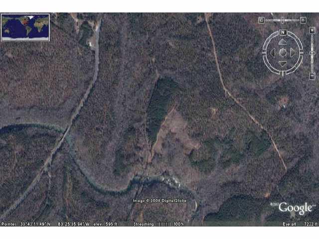 415 undeveloped acre in Oconee County currently zoned AR-5 with considerable road frontage on Hwy 441 also features 5000+ feet of Apalachee River frontage with rapids and shoals, healily wooded land, an old Train Trestle. Minimum lot size 5 acres.