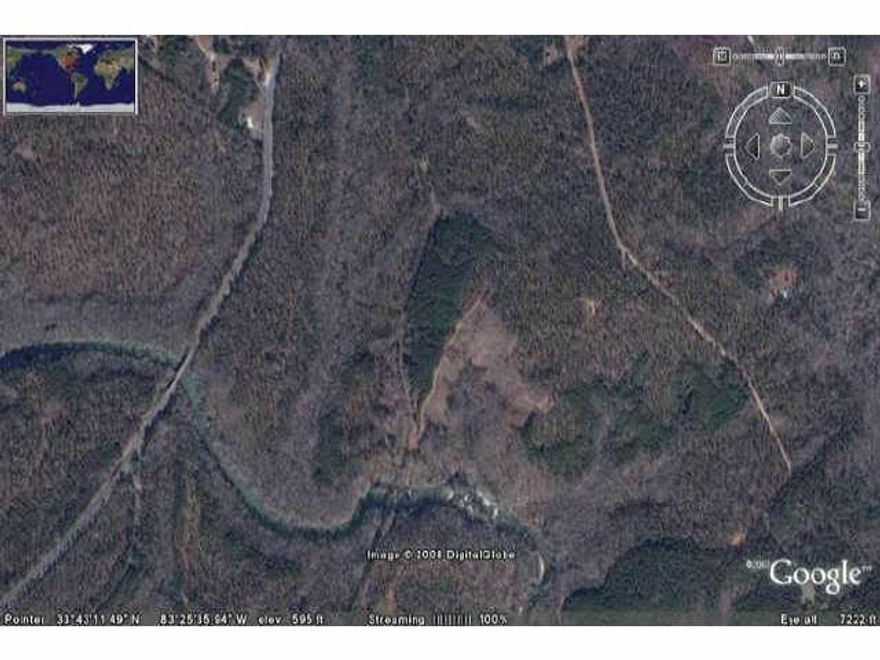415 undeveloped acre in Oconee County currently zoned AR-5 with considerable road frontage on Hwy 441 also features 5000+ feet of Apalachee River frontage with rapids and shoals, healily wooded land, an old Train Trestle. Minimum lot size 5 acres.