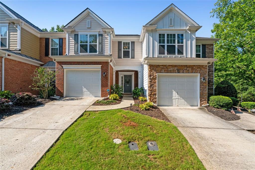 So many UPGRADES! Absolutely gorgeous townhome, perfectly located in a very well-kept neighborhood, is well-appointed and owned by an interior designer. Just minutes from Downtown Woodstock, listed as one of Money's Magazine's top walkable downtown districts in the Nation. Old Town Roswell is a quick drive as well with a beautiful and active walkable downtown area. Over $25,000 of updates added in the last year. Beautiful and bright living and kitchen area allows for easy entertaining. Entire main floor is graced by neutral hardwoods. Dining area is lovely and functional with new custom built-in cabinetry. Don't miss the plugs and phone charges inside the drawers of the built-in. Roof is just 1 year new! NEW Garage Door. Kitchen has been updated and boasts Stainless appliances, New counters, New gleaming brushed gold faucet and cabinetry hardware! Refreshed powder room on main with a new vanity and quartz counters! Modern lighting throughout and Smart Home features. Primary Suite is very spacious and luxurious with a BRAND NEW tile shower and lovely luxury vanity in Primary Bath. Two additional bedrooms and a secondary bath round out the space upstairs. In the fully-fenced backyard oasis, you can sit for coffee and enjoy the sun or relax to quietly end your day. Shopping is just a few minutes away (Publix, Walmart and plenty of restaurants) as well as being situated just a quick walk away to new Little River Park! The Park is under construction and will feature over 100 acres of walking and bike trails, recreation/sports fields, a beautiful community pool, playgrounds with splash pads to cool off, dog parks, picnic shelter houses, dedicated event spaces for music and other festivals....... and so much more!!! The HOA handles lawn maintenance and landscaping so this location is all about a wonderful, low-maintenance lifestyle where you can enjoy home and also lock and leave to travel and enjoy your life!
