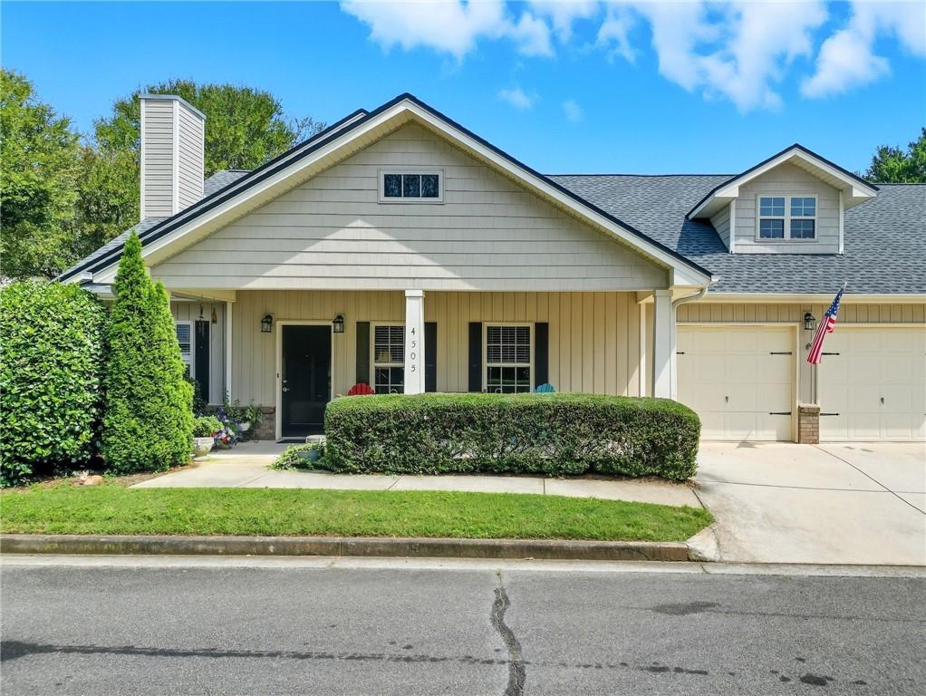 Charming 2-Bedroom Home in Concord Village – 55+ Active Adult Gated Community. Welcome to this beautifully updated 2-bedroom, 2-bath home perfectly positioned on a corner lot, this residence offers low-maintenance living with modern updates and a vibrant lifestyle. Step inside to find engineered hardwood floors (2022) flowing through the open-concept living space. The family room features a cozy fireplace and connects seamlessly to the spacious dining area and chef-inspired kitchen, complete with solid stone countertops, a large island with breakfast bar seating, an oversized pantry, and ample cabinet storage. The primary suite is a true retreat with custom his-and-hers closets and a luxurious ensuite bath featuring a large vanity and a separate shower. A generous secondary bedroom and additional full bath provide comfort for guests. Enjoy outdoor living on your covered front porch or the walkout patio overlooking the landscaped yard. The 2-car garage adds convenience and storage. Recent updates include: New roof (2025) New water heater (2025) New microwave (2025) New dishwasher (2024) and Fresh interior paint throughout. Designed with accessibility in mind, this home features wide interior doorways, making it wheelchair-friendly. Concord Village residents enjoy an array of amenities including a clubhouse, swimming pool, and social activities, all within a gated community. Ideally located close to shopping, dining, parks, and the Silver Comet Trail, this home combines comfort, convenience, and community.