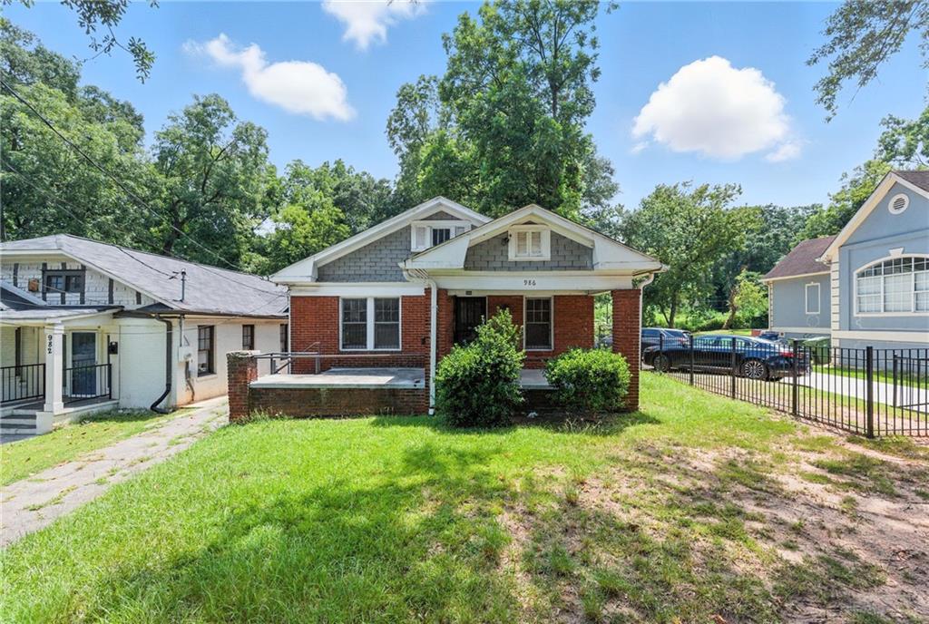 Invest in Atlanta's Westside: This is a great renovation or rebuild project. Discover the potential of 986 Joseph E Boone Blvd NW, a prime opportunity in a revitalizing Atlanta neighborhood. This brick home features 3 bedrooms and 1 bathroom on a 5,400 square foot lot. It is perfectly poised for either a thoughtful renovation or a complete rebuild. Bring your vision to life and transform this property into a modern masterpiece, honoring its historic charm, or consider constructing a brand new home to maximize the value of this ideal location. Enjoy the benefits of a dynamic community with nearby renovations and new construction contributing to a flourishing environment. This home is located in close proximity to Mercedes-Benz & State Farm Arena Stadiums, Georgia Aquarium, World Congress Center and Atlanta Convention Center. Minutes away from the universities. Prime location! Easy access to the interstate, shopping, Midtown & restaurants. Whether your goal is to restore or rebuild, this property offers a compelling canvas for your next real estate endeavor in Atlanta.