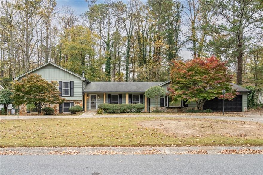 Rare find in the heart of Marietta and desirable Weatherstone! Check out this updated 5 bed/4 FULL bath home featuring new flooring, interior paint, updated bathrooms, new lighting and plumbing fixtures. This home offers immaculate curb appeal and a spacious two car garage. Large living room right inside the front door. The spacious kitchen overlooks a cozy family with fireplace. Also off the kitchen is a formal dining room. There is also a 3 season porch with plenty of natural lighting that's accessible from the kitchen. Kitchen comes equipped with hard surface countertops, stainless steel appliances, and large dining space. Large Master suite on the main level with a spacious bathroom that includes a large walk-in shower and separate soaking tub. Upstairs you'll find 3 additional bedrooms and 2 more full baths. Once of the bedrooms has it's own bathroom. Two more additional secondary bedrooms and full secondary bathroom also upstairs. The lower level has one more bedroom and an additional FULL bath. Out back offers a large deck overlooking the huge backyard. Close to shopping, schools and entertainment. Check it out!