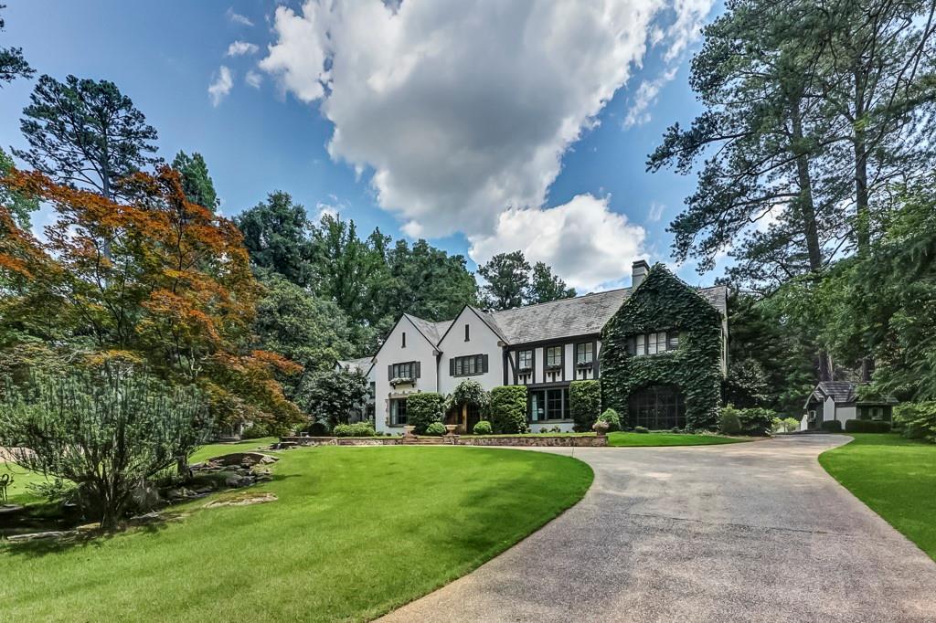 Heart of Tuxedo Park, located at the corner of Valley Road and Tuxedo. This gated English Manor estate features, lovely renovated main residence, two guest houses, tennis court, pool, putting green, playhouse, six car garage, flat, walk out, beautiful mature landscape. Originally built by the developer of Tuxedo Park, Charles Black as his personal home on one of the premier lots in Buckhead. Living Room with fireplace, Dining room, Library with fireplace, Family room off of kitchen, Wine Cellar with stone floors from France and iron doors. Secondary bar, Family room with large stone fireplace opening to Pool Terrace, 5 bedrooms, sitting/study area, 2 home offices, 4 full baths, 3 powder rooms and iron casement windows throughout. Guest House overlooking the pool and tennis court with 2 bedrooms, living room and kitchen, 2 and 1/2 bath and exercise room. Second Guest house with 1 bedroom, living room and kitchen with 1 full bath. Large terrace with outdoor fireplace and arbor for entertaining off of the family room.