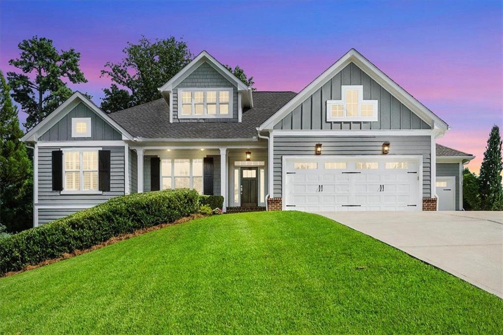 Welcome to this beautifully designed 4-bedroom, 3.5-bath residence in the heart of Flowery Branch—a true entertainer’s delight! Step inside through the grand foyer with soaring high ceilings, setting the stage for elegance and warmth throughout. Just off the entrance, you’ll find a versatile den or office space, ideal for working from home or unwinding with a book.
The main level boasts a spectacular open floor plan, seamlessly connecting the expansive kitchen, great room, and dining area—each perfect for hosting gatherings and creating memories. Both the great room and dining area feature cozy fireplaces, while the gourmet kitchen dazzles with a generous island, double ovens, and a gas cooktop, offering an abundance of space to cook, mingle, and entertain.
Retreat to the luxurious master suite on the main floor, highlighted by a beautiful tray ceiling and an abundance of natural light. The master bathroom is truly massive, complete with a spa-like soaking tub, separate shower, and a walk-in closet that impresses with four full walls of hanging space and its own bright window.
For added convenience, the spacious laundry room with sink is also located on the main floor. Throughout the home, countless windows flood every room with natural sunlight, creating a cheerful, airy ambiance.
An open staircase leads to the reverse floor plan’s lower level, where you’ll find all secondary bedrooms and bathrooms, an extra living room for movie nights or gatherings, plus a handy kitchen area with refrigerator and sink—offering so much flexibility for guests or multi-generational living.
This exceptional home combines thoughtful design, luxury finishes, and space galore, making it one you won’t want to miss. Schedule your tour today and discover all that this Flowery Branch gem has to offer!