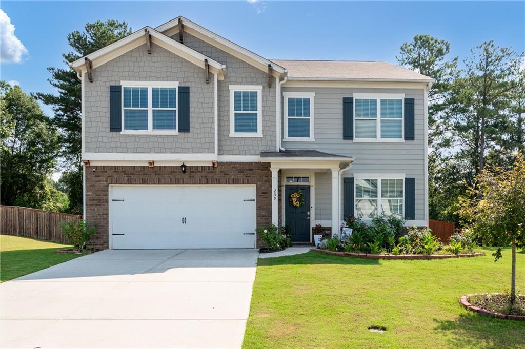 Welcome to this spacious two-story home featuring 5 bedrooms and 3 full bathrooms, offering plenty of room for comfortable living. The open floor plan includes a modern kitchen with ample counter space, a bright dining area, and a cozy family room perfect for gatherings. On the main level, you’ll find a guest bedroom and full bath, ideal for visitors or a home office, while upstairs the oversized primary suite offers a private bathroom with double vanities, a soaking tub, and a walk-in closet. Three additional bedrooms share a full bath and provide generous closet space. The home also features a two-car garage, a fenced backyard with landscaped garden beds, and a spacious driveway, all conveniently located near shopping, dining, and schools for both comfort and accessibility.