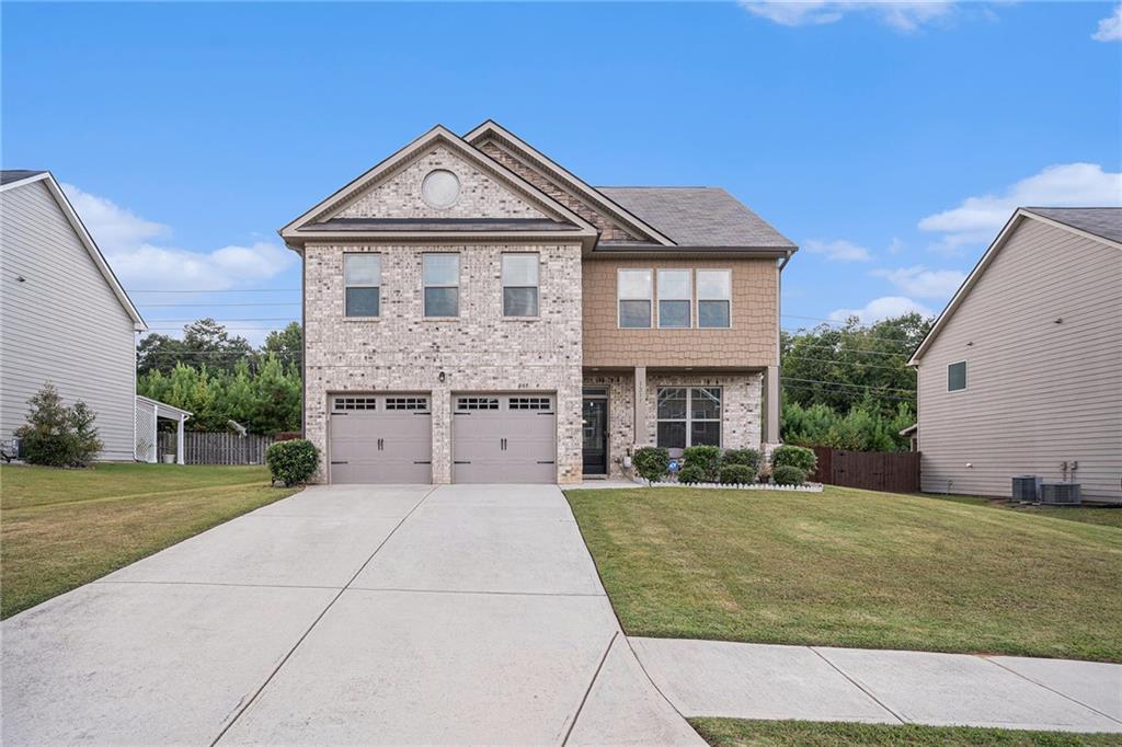 Nestled in the desirable Brookstone neighborhood of Conyers, this stunning home offers the perfect blend of comfort, style, and unbeatable location. Located close to the interstate you'll enjoy peaceful suburban living with easy access to the city. This 4-bedroom, 2.5-bathroom modern home offers 2,336 square feet of beautifully designed living space. Built in 2019, this nearly-new home features an impressive open-concept kitchen maximizes space and natural light that flows seamlessly into the living areas. Separate dining room, family room with fireplace perfect for entertaining family and friends or enjoying quiet evenings at home. Relax and unwind in the primary suite! En Suite bathroom includes double vanity, large walk in closet, separate shower and soaking tub. Step outside your door to endless entertainment and recreation! The fenced in backyard is built for gatherings or a peaceful evening.