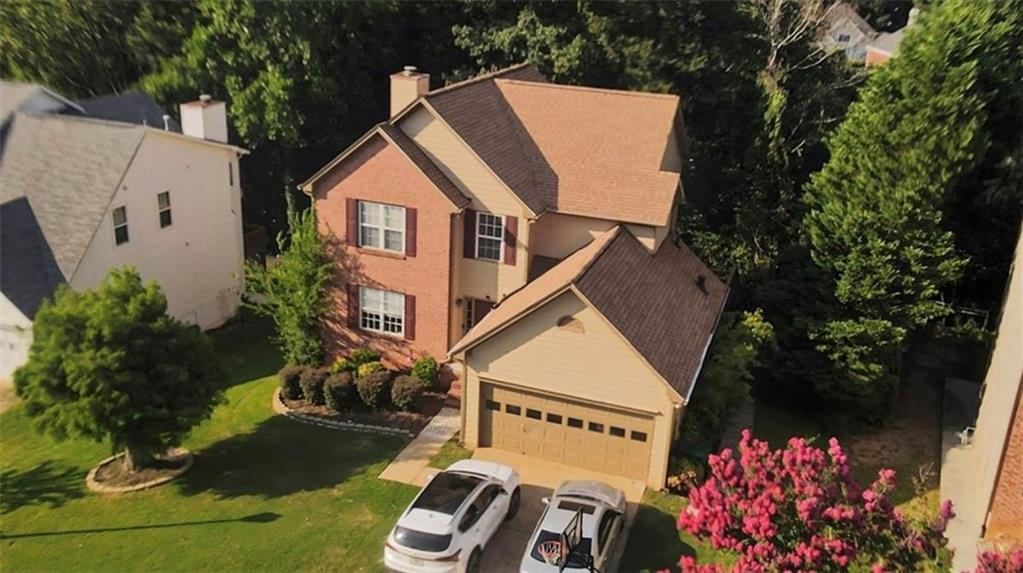 Fully finished basement with a separate entrance, complete with a kitchen and living room—perfect for guests or multi-generational living. Located in the highly sought-after Peachtree Ridge school cluster. Enjoy a beautiful back deck and a brand-new kitchen with granite countertops, stainless steel appliances, and a gas cooktop. Freshly painted interior and a roof replaced in 2023.
This home features a stunning two-story foyer, a spacious family room with a fireplace, and a gorgeous sunroom with abundant windows that bring in natural light. The maintenance-free backyard is ideal for easy living.
Conveniently located with quick access to Atlanta, Duluth, I-85, and I-985, commuting is effortless. Shopping and dining are just a short walk away—don’t miss this opportunity to own a beautiful, move-in-ready home in an unbeatable location! Priced to sell.