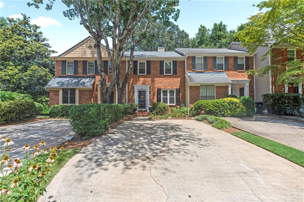 Welcome to your dream townhome in the sought-after Ivy Glen community of Smyrna! This bright, spacious, and beautifully updated home offers modern comfort in a peaceful, well-maintained neighborhood. Step inside to find stunning LVP flooring throughout the main level, where an inviting living room with a cozy fireplace sets the perfect tone for relaxing or entertaining. The renovated kitchen boasts crisp white cabinetry, granite countertops, and stainless steel appliances—ideal for any home chef. Enjoy quiet evenings or morning coffee on the private back deck, especially during cool fall nights. Upstairs, you'll find two generously sized bedrooms, each with its own en-suite bathroom and ample closet space. The daylight basement offers incredible flexibility—use it as a third bedroom, home office, gym, or extra storage space. The oversized driveway is perfect for multiple/large vehicles and guests! Other major updates include: new roof (2024), whole-house re-plumbed (2023), newer HVAC (2021), newer hot water heater (2019), newer windows (2018) updated vanities, updated deck, updated light fixtures, and fresh interior paint! This truly move-in ready home is part of a serene community with some of the lowest HOA fees in the area—offering great value in a prime location. Don't miss this great opportunity in Ivy Glen!