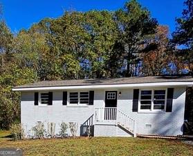 Charming ranch totally renovated and newly added 23k 12x16 screened in porch on 1 acre of land and sits back for privacy on wooded lot with hardwoods all around. Solid 3/4" hardwood floors throughout with new kitchen with white shaker cabinets, quartz countertops with tiled backsplash and new stainless appliances. New bathroom with floor to ceiling tile in tub/shower and new vanity with quartz countertop. Roof replaced end of October 2021, Hot water heater June 18, 2025, septic letter and clearance April 2025. Come see your new home just about 4 miles from downtown Monroe.