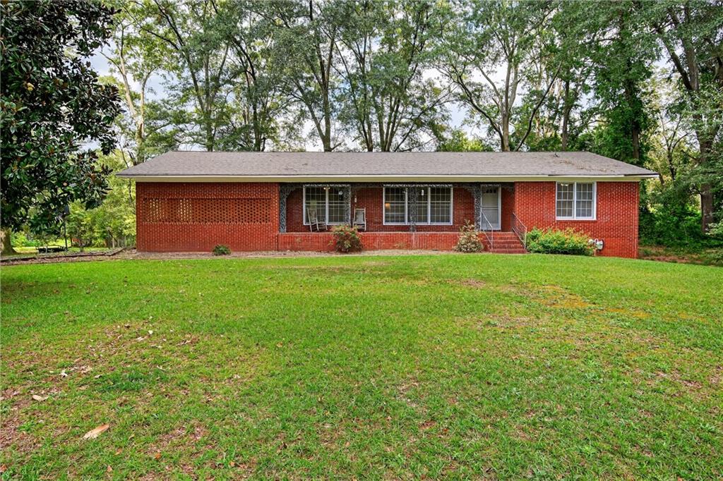 3 Br/ 2 Ba brick ranch in Bowman, GA sits on a sprawling 4.66 acre lot in a residential area with no HOA. The home provides ample natural light, light hardwood flooring, vintage tile bathrooms, laundry room, unfinished walk-out basement, new roof, classic rocking chair front porch with step down access to carport, and a masonry wood-burning fireplace. Enjoy peaceful living with easy access to nearby Lake Hartwell, Athens, and a number of neighboring towns with weekly farmers markets and community events.