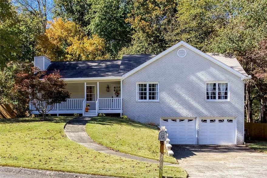 Super home in a super school district and very close to shopping (Target, Publix, Home Depot, Office Depot, Starbucks, Chik-fil-a, West Cobb Diner) and quick access to I-75! Seller has repainted the interior, added new flooring, replaced all light fixtures and updated the kitchen and both bathrooms, this home is ready to go!  Located well inside the Zachary Woods subdivision and on a cul-de-sac, you will enjoy the privacy and the sunrise as the front of the home faces due east! From the spacious front porch to the fenced in backyard the seller has added many personal touches to update the home and make moving in easy-breezy! The home has a large unfinished area in the basement and a wide and deep 2 car garage that has plenty of space for work benches and hobbies. Come see this home and enjoy living in this peaceful neighborhood.
