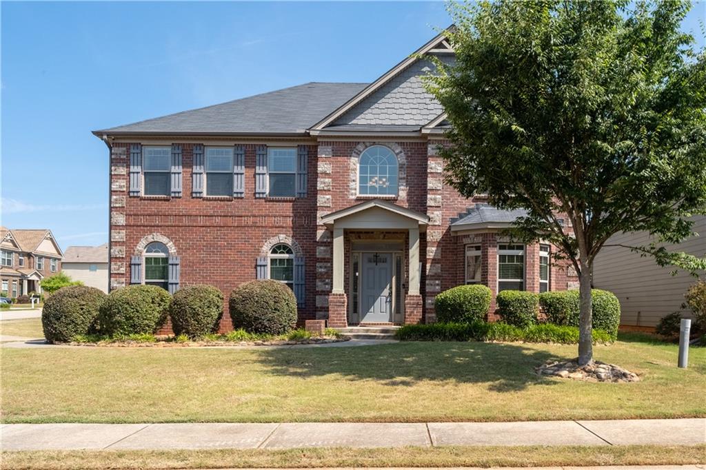 We are excited to announce a recent price improvement on this stunning move-in ready home! With its exceptional features and prime location, this opportunity won't last long on the market, so act quickly! Welcome to your dream home in the highly sought-after Parkside at Avalon subdivision in McDonough. This stunning brick front 4-bedroom, 2.5-bathroom gem is perfectly situated on a desirable corner lot, offering both privacy and a spacious feel.
Step inside to discover a cozy family room adorned with a beautiful fireplace. The modern kitchen is a chef's delight, featuring elegant granite countertops, 42” cabinets, and ample space for all your culinary adventures. The kitchen also features a large and spacious walk-in pantry. The dining room boasts sophisticated coffered ceilings, adding a touch of luxury to your gatherings. Retreat to the oversized owner's suite, complete with vaulted ceilings and a spa-like bathroom featuring an oversized tub, separate shower, double vanity, and a huge walk-in closet that will amaze you. Two of the additional bedrooms share a convenient Jack and Jill bathroom, and all bedrooms feature vaulted ceilings. The laundry room is conveniently located on the second floor. The fenced-in, spacious backyard is perfect for outdoor entertaining and provides a safe haven for children and pets to play.
Location is everything, and this home delivers! Just minutes away from South Point, you’ll enjoy an abundance of shopping and dining options right at your doorstep. Don’t miss this incredible opportunity to own a piece of paradise in McDonough. Schedule your showing today and fall in love with your new home!