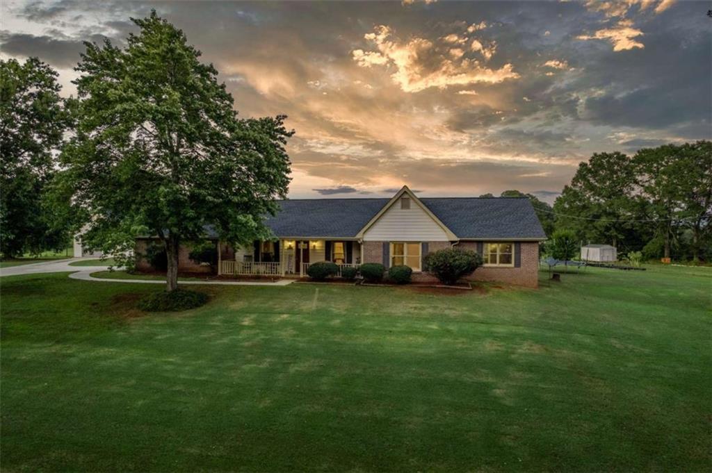 Come enjoy the charm and serenity of this 4 sided brick ranch nestled on a 3.03 acre parcel in covington's most sought after location. This property is the perfect blend of country tranquility and convenient access to town and amenities. The over 3 acre lot is perfectly designed featuring an inground pool for those hot summer days, Covered boat and RV storage, a garden area ready for your green thumb, an additional garage and workspace for all your hobbies, and plenty of entertainment with the cows in the back pasture (additional acreage could be available). And your animal friends will love this place!!! A dog kennel off the back of the workshop and the chicken coop are just a few places they can call home. Inside you will find and oversized family room/ great room that will hold all of your large furniture, expansive kitchen with abundant cabinet space right off the family room. A sunroom for morning coffee and a good book. 5 bedrooms (a large addition was added so the tax assessors square footage is not correct) that can be used for other things such as an office, workout room, or home theater. The possibilities are endless. It is rare that properties like this come available, so don't miss your opportunity to own this amazing home!!