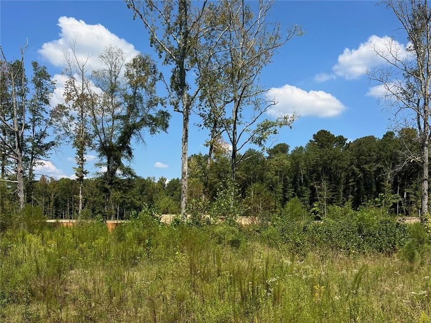 Wonderful opportunity in a prime West Cobb location! 5 beautiful acres with a large homesite cleared and ready to build. Sewer lines recently installed on the lower side of the property. Incredible location only 12 minutes from the Marietta Square and 22 minutes from The Battery Atlanta. The west side of the property borders historic Mud Creek and a portion of the property is in the 100 year flood zone. Currently zoned residential R-30 with enough space for at least two homesites.