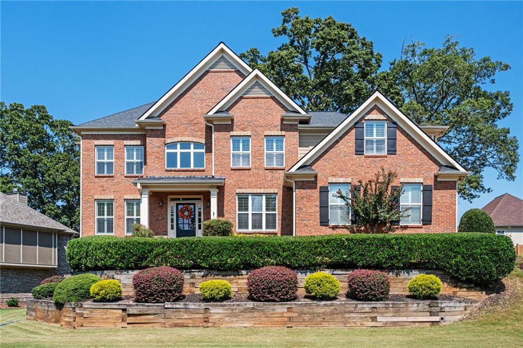 Entertainers Dream House! Huge kitchen with stainless steel appliances, granite countertops, tile backsplash, and kitchen island in addition to a breakfast area. Kitchen opens to the family room with a beautiful wall of windows looking over the in-ground pool, outdoor kitchen and fire pit. Grand foyer with hardwood floors and dining room with coffered ceiling. Bedroom and full bathroom on the main floor. Oversized primary bedroom with built ins, double trey ceiling, luxurious on suite with all the upgrades. Screened in porch perfect for your morning coffee or evening wine. Don’t forget about the partially finished basement with rec room, media area, and a full bathroom. Unfinished area is perfect for storage/workshop or for potentially adding additional bedroom and square footage. Come see it today!