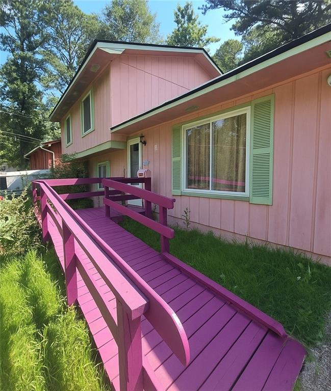 Don't miss this incredible opportunity to own a spacious split-level home just minutes from I-85, shopping, dining, and local parks. This well-designed property offers a formal living and dining room, plus an eat-in kitchen with classic wooden cabinets, ample storage, and generous counter space. Enjoy a cozy sunken family room filled with natural light and centered around a charming fireplace. Adjacent to the family room is a versatile bonus room with a closet—perfect for a home office, media room, or potential 4th bedroom. Upstairs, the primary suite features an updated walk-in shower and modern vanity. Two additional bedrooms and a full bathroom complete the upper level. Key updates include a newer roof and water heater, and the HVAC system appears to be in good working condition. With great bones and endless potential, this home is ready for your personal touch. Bring your designer and contractor to explore how this space can be transformed into your dream home. You'll love the layout, location, and everything the area has to offer. Schedule your showing today—this one won’t last long!