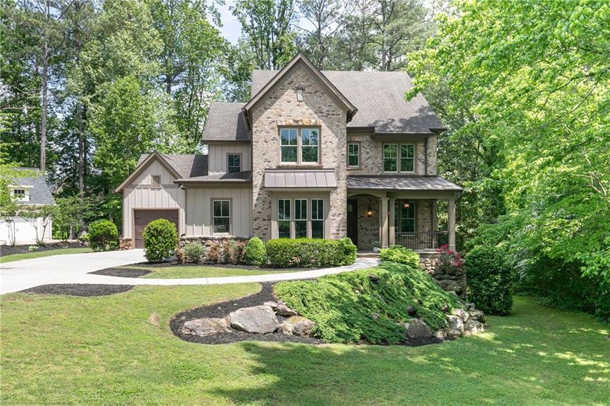 Welcome to this stunning custom brick and stacked stone home by Caldwell Cline. Perfectly timed for summer enjoyment, it features a sparkling pool, relaxing hot tub, and a beautifully landscaped, private backyard—an entertainer's dream.
Nestled on a quiet cul-de-sac just minutes from Indian Hills Country Club and East Cobb's premier shopping and dining, this three-story, six-bedroom, four-and-a-half-bath residence offers luxury, comfort, and convenience. 
The level driveway leads to ample guest parking and a spacious three-car garage with an electric vehicle charging station, room for all your cars, toys, and more.
Inside, the open-concept chef's kitchen flows seamlessly into a spacious family room and a cozy screened porch with a stacked stone fireplace. A walk-in pantry, formal dining room, mudroom, guest suite with full bath, and stylish half bath complete the main level — all highlighted by gleaming hardwood floors.
Upstairs, the primary suite is a serene retreat featuring a tray ceiling, a sitting area, a spa-like bathroom with a soaking tub and a separate shower, and an oversized custom walk-in closet. The upper level also offers a large central flex space ideal for a second family room, office, or playroom, plus three additional bedrooms — one with an ensuite bath and two sharing a Jack-and-Jill bath. Don't miss the secret hidden room waiting to be discovered!
The terrace level, with walkout access to the backyard and pool area, features a spacious living area perfect for numerous activities, complete with a wet bar. There is an additional guest bedroom and full bath. The unfinished portion offers ample storage, or could be finished to create extra living space.
Zoned for Eastside, Dickerson, and Walton High School, this stunning property has it all.